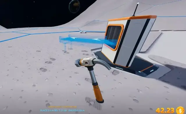 Robot Vacuum dock with a short blue conveyor preview being drawn from it across the lunar ground