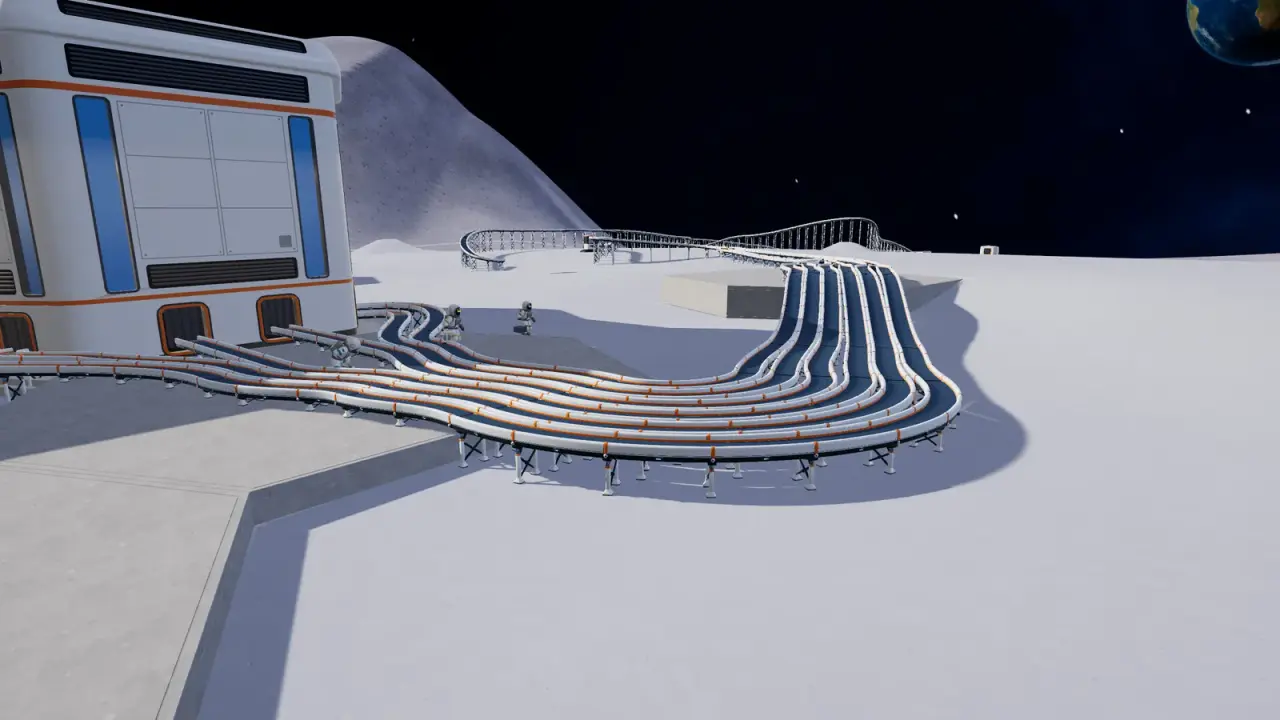 Bundle of conveyor belts raised on support legs, leaving open ground beneath them beside the station
